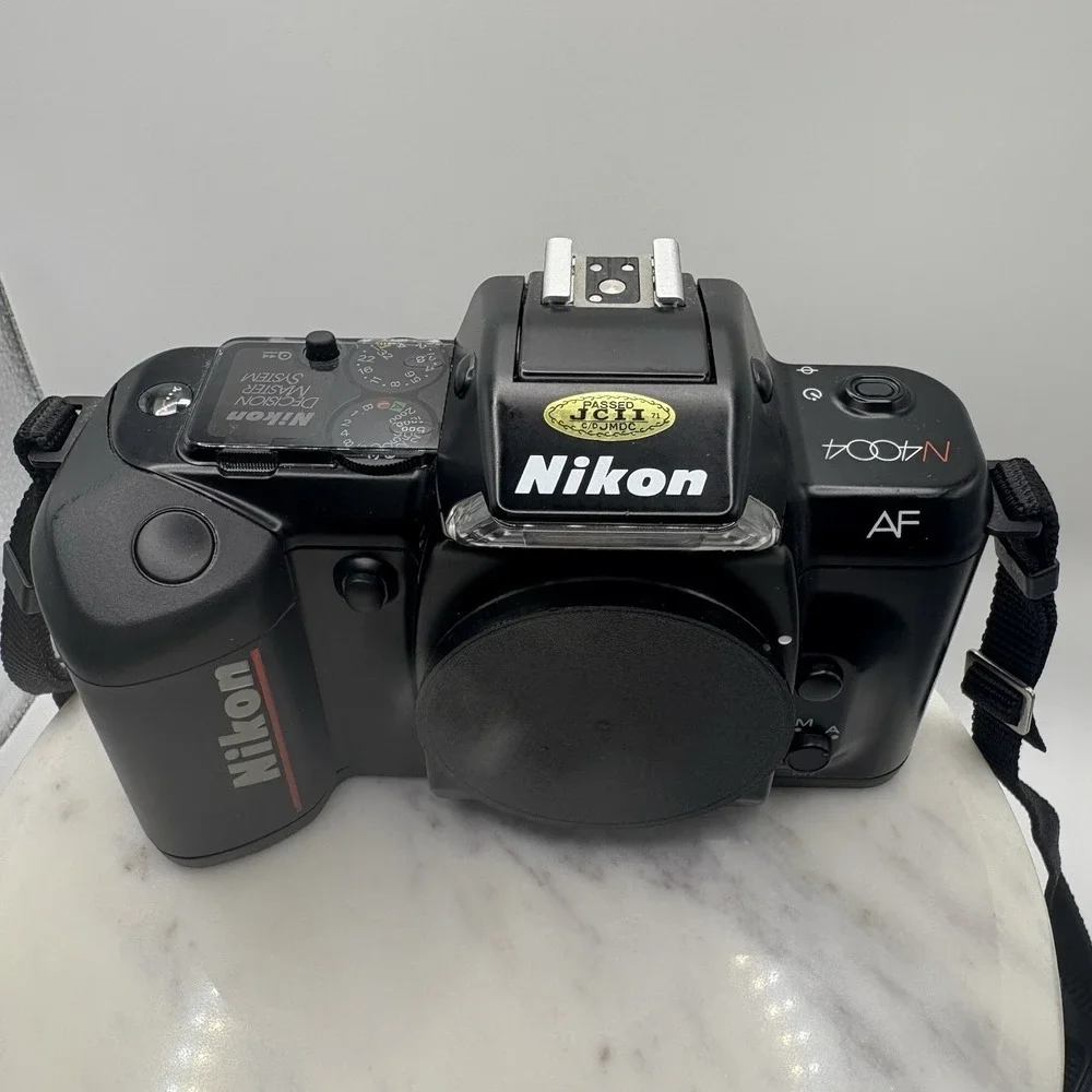 Vintage Nikon N4004 AF 35mm SLR Film Camera Body Only W/ Manuals Bag Powers On